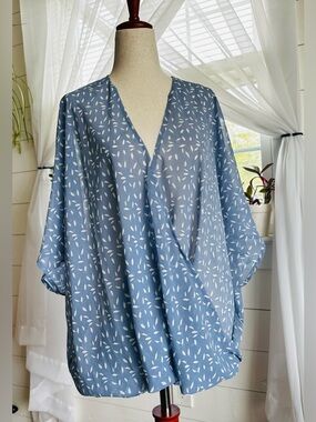 AAKAA sheer surplice blouse. V-neck with a draped, twisted front hem. 
Size: S